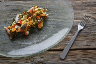 Smoked sardines salad with creamy cheese corn codium and hazelnuts