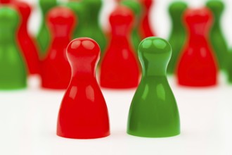 Red and green pawns. Coalition government between red and green. Austria