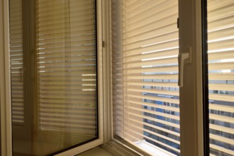 Blinds are fitted to a window to protect against heat and sun. Austria