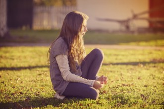 Tween kid girl profile in the park at sunset side view