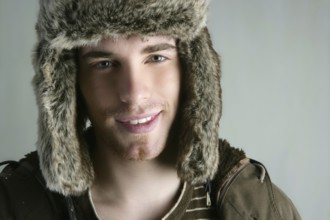 Fur winter fashion hat young man brown autumn color