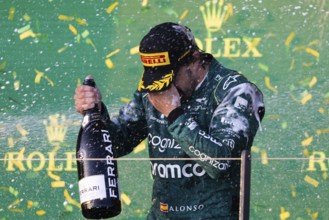 MELBOURNE, AUSTRALIA, APRIL 2: Fernando Alonso of Spain celebrates his 3rd place for Aston Martin