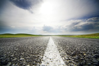 High speed road with cloudy sky background