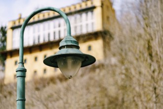 An old street lamp on a metal pole.