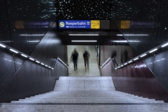 Entrance to the Reeperbahn underground station while two people walk down the stairs, St. Pauli,