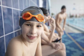 Belarus, the city of Gomel, 10 March 2021. School swimming pool. A boy with a swimming cap looks