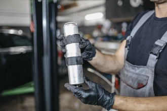 Car repair in car service fuel filter replacement