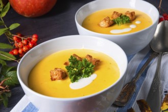 Delicious pumpkin soup with croutons and coconut milk