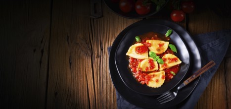 Ravioli alla genovese with basil and tomato sauce