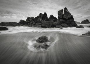 A dramatic sunset seascape at a northern California beach in black and white. USA