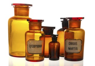Glass bottles as pharmacy equipment isolated over white background