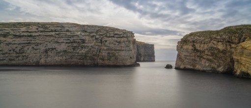 A panorama landscape view of Dwejra Bay and Ufo Rock on Gozo Island in Malta
