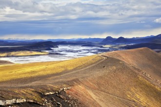 National park Landmannaleygar in July. Comb orange rhyolite mountains dashed off tourist jeeps