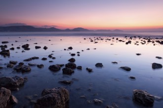 Colorful sunrise on the rocky sea coast