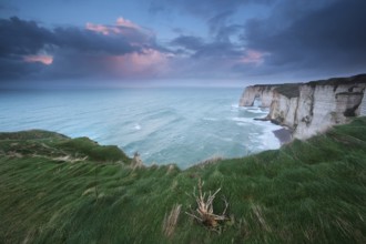 Stormy sunrise over cliffs in Atlantic ocean, Etretat, France, Europe