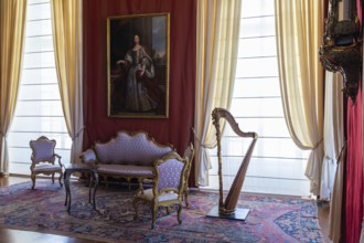 Venaria Reale, Italy, February 2023: luxury interior, old Royal Palace. Perspective with harp,