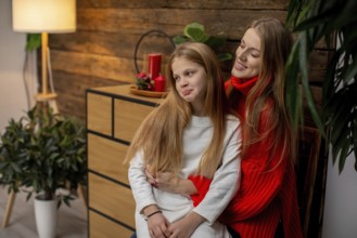 A warm and cozy indoor scene beautifully capturing a mother and daughter joyfully sharing sweet