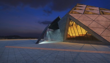 Contemporary triangle shape design modern Architecture building exterior with glass, concrete and