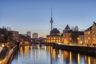 The Spree, the Bode Museum and the television tower in Berlin in front of sunrise