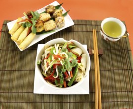 Freshly prepared beef noodle stirfry with dimsums ready to serve