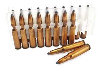 Packing ammunition for the automatic weapons and two cartridges lie separately isolated on a white