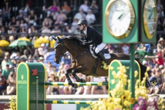 Daniel Coyle of Ireland and riding Legacy compete in the first round of the 1.60m CPKC
