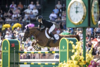 Jana Wargers of Germany and riding Dorette Old compete in the first round of the 1.60m CPKC