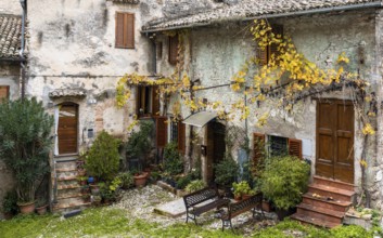 Spoleto, Italy, 25 November, 2022: rustic stone house and small backyard in the historic city