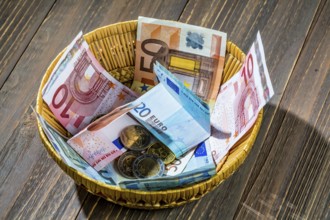 A basket with money for donations and tips Austria