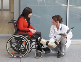 Young woman with leg in plaster Austria
