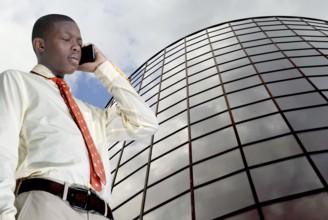 African American teenage man talking on the phone