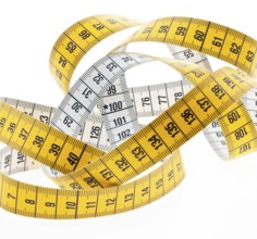 A yellow tape measure on a white background. Austria