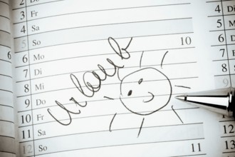 An appointment is entered in a calendar: Holiday Austria