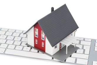 House on keyboard, symbolic photo for buying and renting a house via the Internet