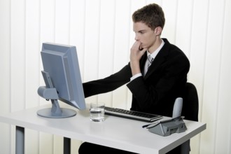 A man has problems with computer virus and spam in the office Austria