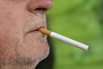 Man with a cigarette in his mouth
