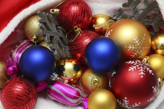 Bright christmas balls, toys in red bag