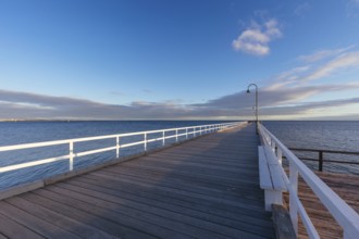 Kerford Rd Pier and Albert Park Yachting Angling Club in Albert Park at sunset on a winter's