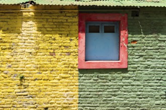 Colourful wall with windows in the La Boca district, Buenos Aires Argentina