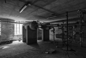 A picture of some abandoned pipes and valves