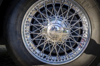 Lisbon, Portugal, Jan 20, 2024: Car design detail of Jaguar chrome wire wheel, stainless steel