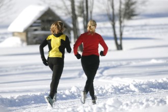 Running in the snow, man, 35, 40, years, running, running, snow, winter, two woman