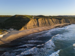 Magoito Beach and Cliffs at Sunset during Low Tide. Atlantic Ocean, Portugal. Golden Hour. Aerial
