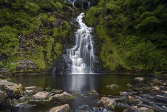 A horizontal view of the picturesque Assaranca Waterfall on the coast of County Donegal in Ireland