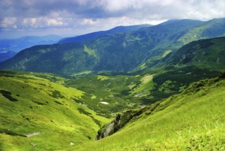 Beautiful mountains landscape with lake and clouds in Carpathian mountains