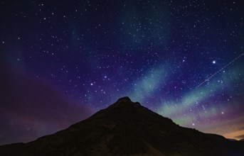 Of Iceland Aurora and mountain silhouette. Shooting Location: Iceland, Reykjavik