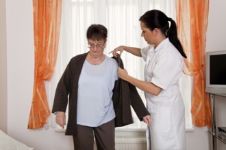 A carer caring for the elderly in a retirement home in Austria