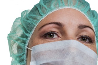A nurse or doctor in surgical clothing in front of an operation. Symbolic photo for stress and
