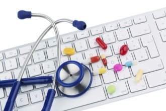 Tablets on keyboard, symbol photo for online pharmacies and drug costs Austria