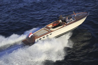 Aerial view sports boat J Craft 42 Torpedo R at full speed on the Cote d'Azur, luxurious motorboat